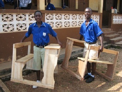 Boys carrying Anglican Desks
